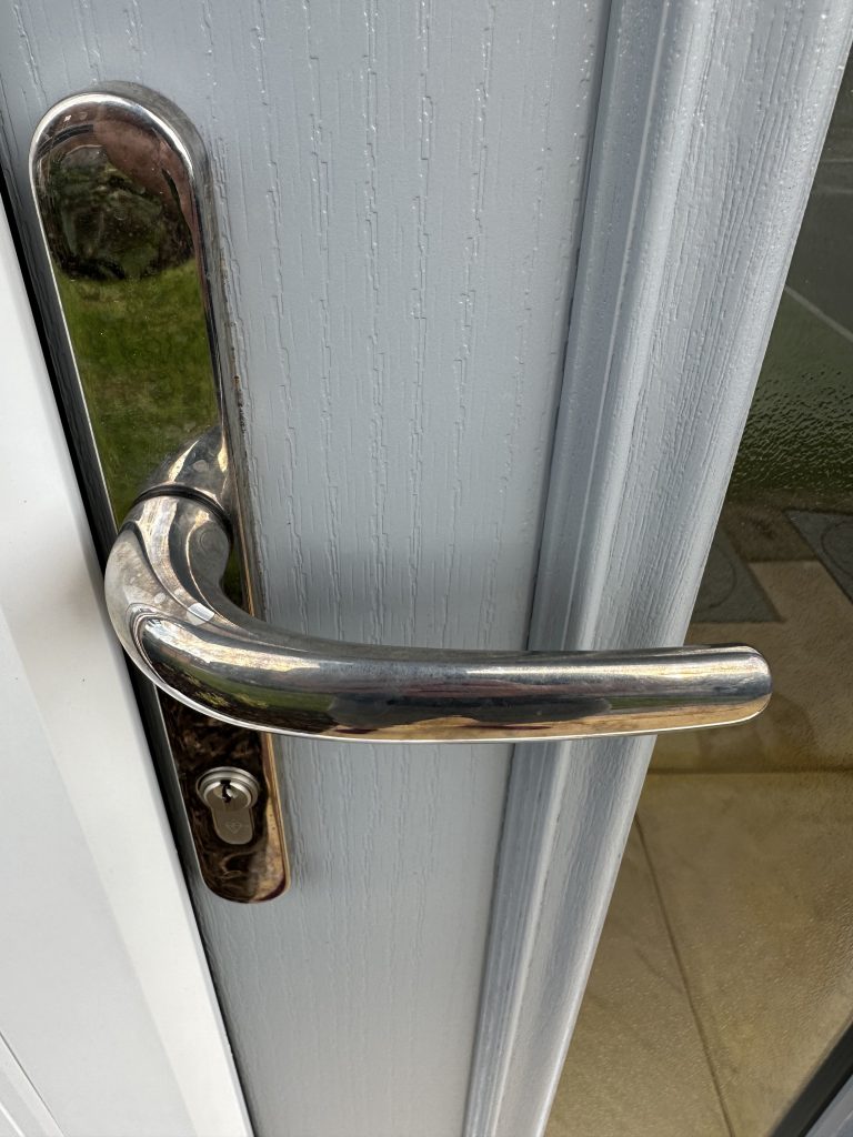 tarnished door handle from brick acid